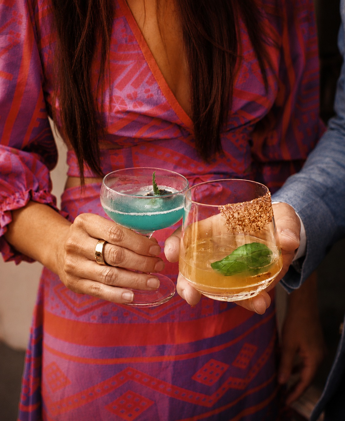 Guests holding signature cocktails